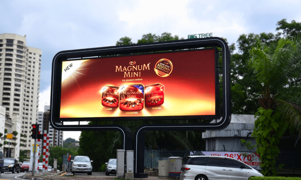 LED billboard screen showing Magnum advertisement